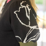 Color Blocked Band Floral Knit Top in back at ooh la la! in Grapevine TX 76051