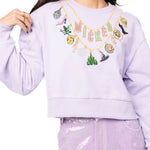 Wicked X Queen of Sparkles Lavender Wicked Charm Necklace Sweatshirt at ooh la la! in Grapevine TX 76051