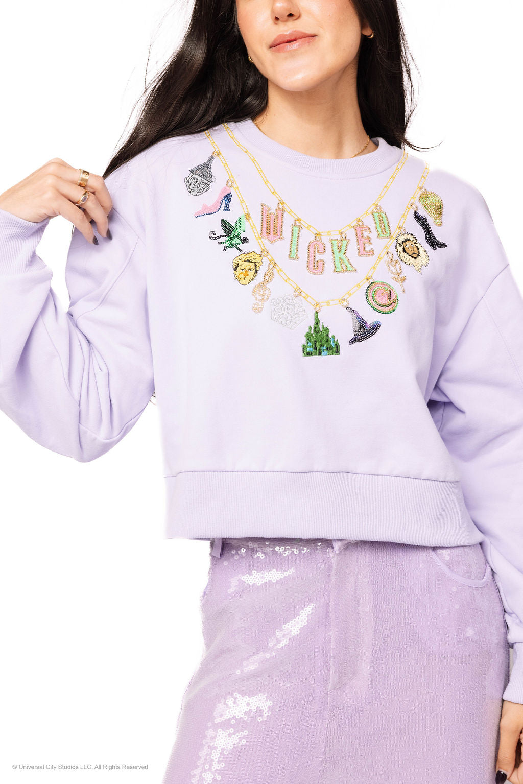 Wicked X Queen of Sparkles Lavender Wicked Charm Necklace Sweatshirt at ooh la la! in Grapevine TX 76051