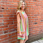 Boho beach dress, neon summer dress, flutter sleeve mini, geometric print dress, tassel trim dress, resort wear for women, cotton v-neck dress, vacation outfits, colorful sun dress. at ooh la la! in Grapevine TX 76051