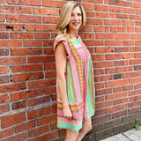 Boho beach dress, neon summer dress, flutter sleeve mini, geometric print dress, tassel trim dress, resort wear for women, cotton v-neck dress, vacation outfits, colorful sun dress. at ooh la la! in Grapevine TX 76051