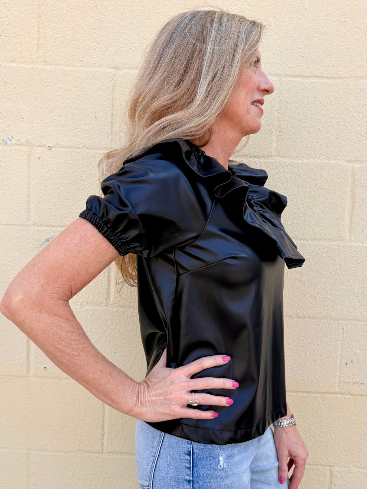 Ruffle V Neck Faux Leather Top in black at ooh la la in Grapevine TX 76051