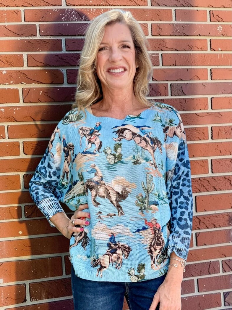 Giddy Up! Western Cowboys and Leopard Batwing Sweater in blue at ooh la la! in Grapevine TX 76051