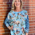 Giddy Up! Western Cowboys and Leopard Batwing Sweater in blue at ooh la la! in Grapevine TX 76051