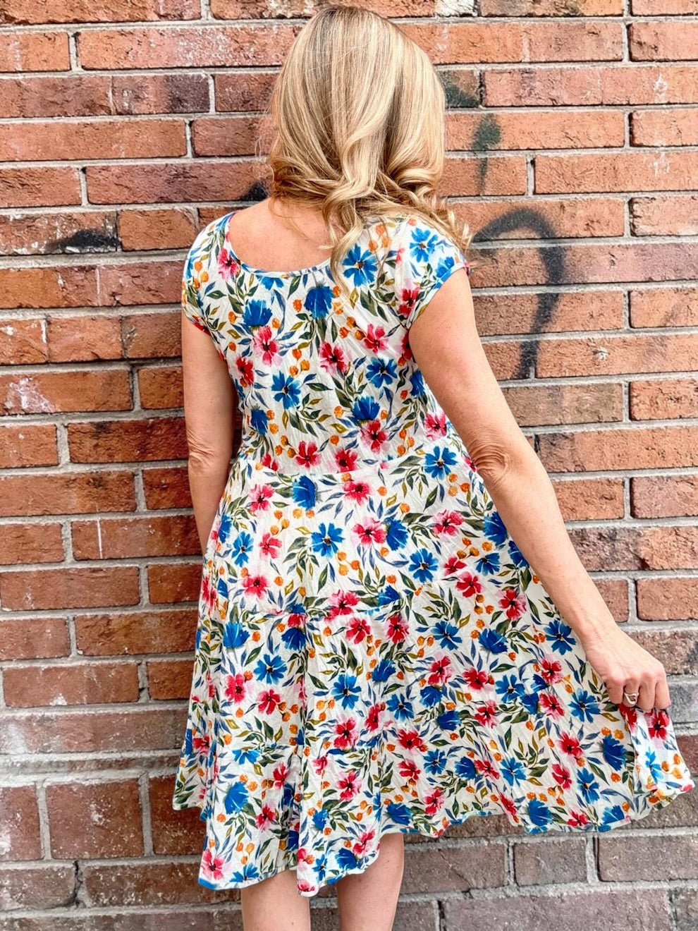 Dress Addict Jade dress, organic cotton floral dress, daisy print scoop neck, bias cut cotton dress, crinkle cotton summer dress, sustainable floral fashion, tiered skirt knee length dress at ooh la la! in Grapevine TX 76051