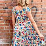Dress Addict Jade dress, organic cotton floral dress, daisy print scoop neck, bias cut cotton dress, crinkle cotton summer dress, sustainable floral fashion, tiered skirt knee length dress at ooh la la! in Grapevine TX 76051