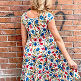 Dress Addict Jade dress, organic cotton floral dress, daisy print scoop neck, bias cut cotton dress, crinkle cotton summer dress, sustainable floral fashion, tiered skirt knee length dress at ooh la la! in Grapevine TX 76051