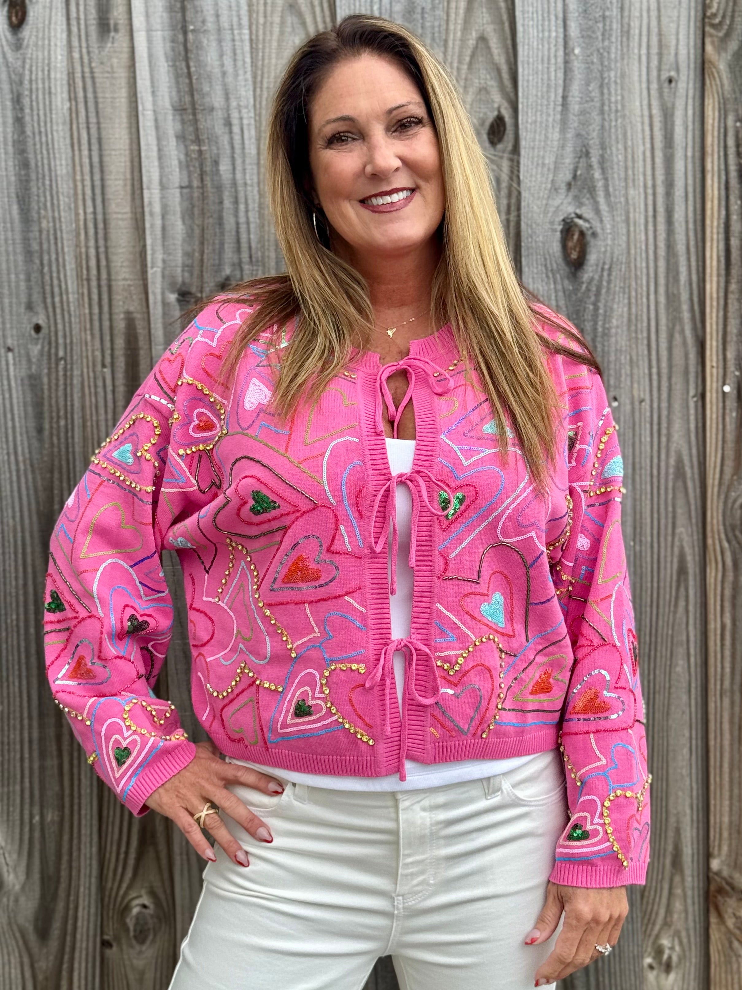 Queen of Sparkles Multi Groovy Heart Tie Up Sweater in hot pink at ooh la la! in Grapevine TX 76051