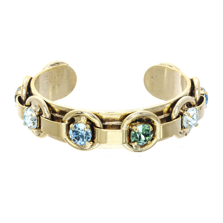 TOVA Henley cuff bracelet in gold with blue and green sea-toned crystals at ooh la la! in Grapevine TX 76051