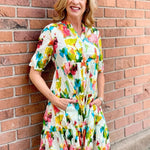 Organic cotton dress, floral shirt dress, tiered summer dress, Dress Addict, crinkle cotton dress, sustainable fashion, abstract floral print, summer dresses with pockets. at ooh la la! in Grapevine TX 76051