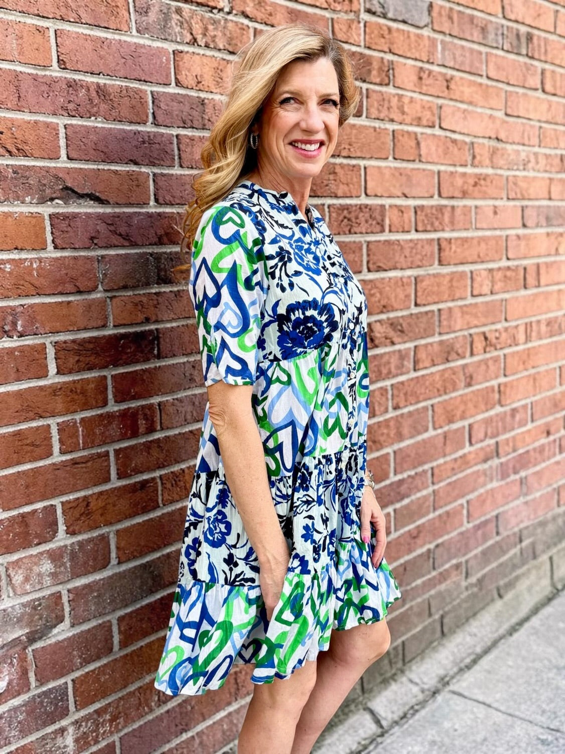 Organic cotton dress, floral shirt dress, tiered summer dress, Dress Addict, crinkle cotton dress, sustainable fashion, mixed floral and hearts print, summer dresses with pockets. at ooh la la in Grapevine TX 76051