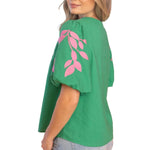 embroidered linen top, bubble sleeve blouse, green floral top, resort wear for women, v-neck summer blouse, pink and green top, botanical embroidery clothing, puff sleeve linen shirt at ooh la la! in Grapevine TX 76051