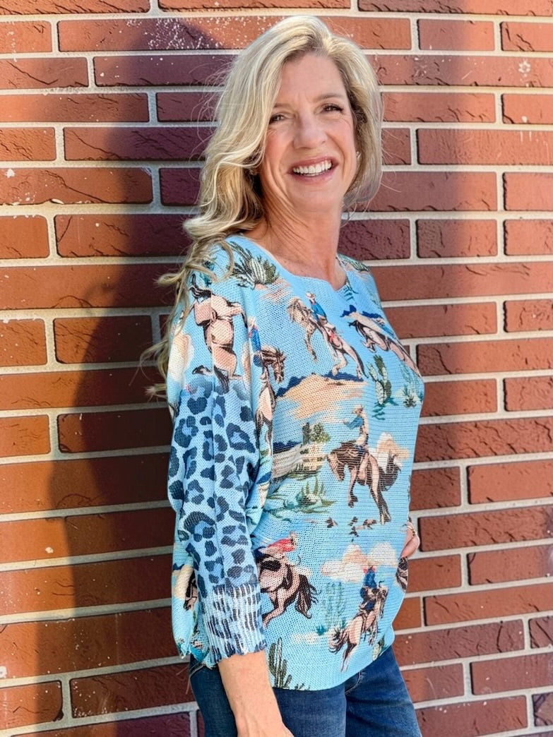 Giddy Up! Western Cowboys and Leopard Batwing Sweater in blue at ooh la la! in Grapevine TX 76051
