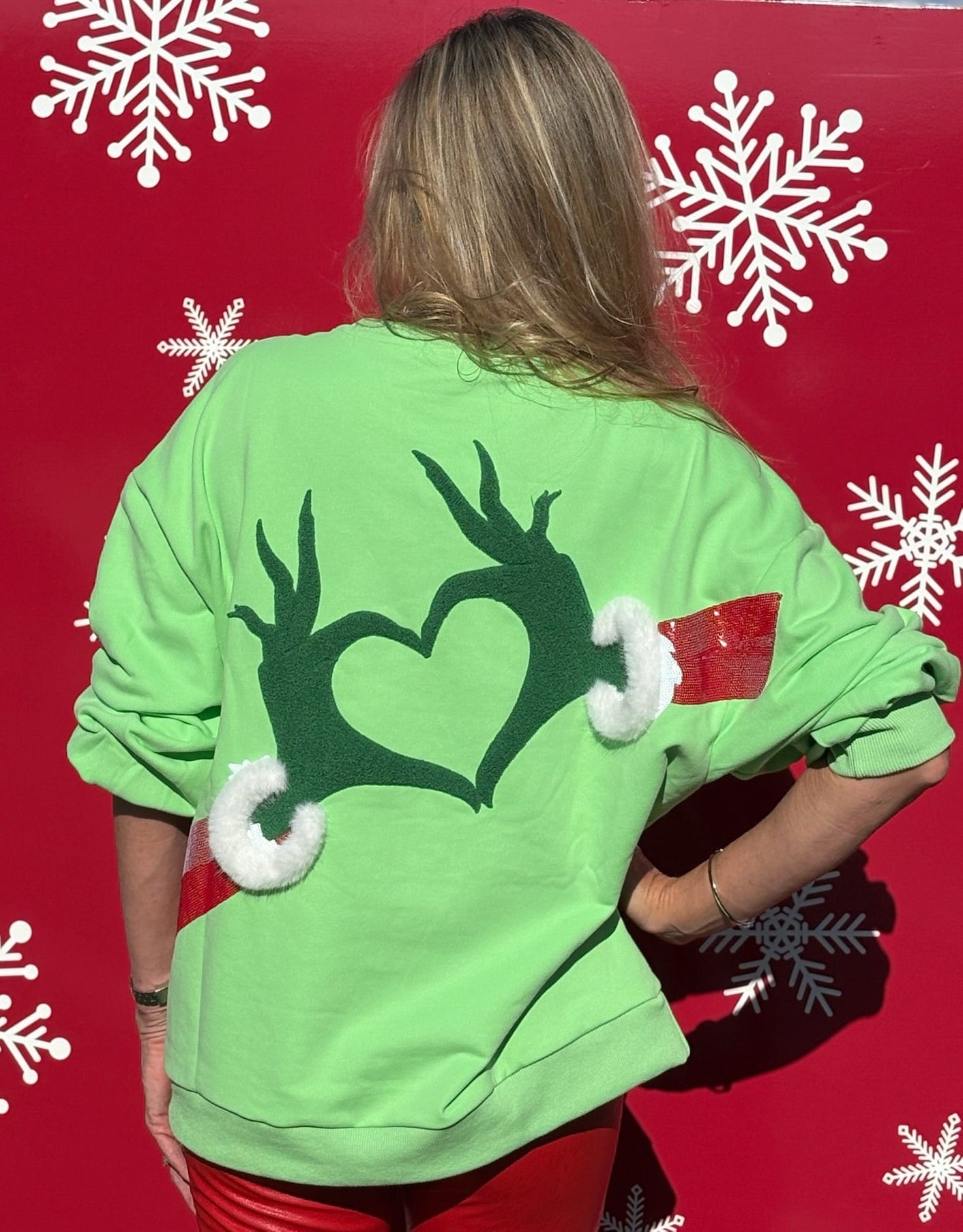 Queen of Sparkles Green Grinch Heart Hands Sweatshirt at ooh la la! in Grapevine TX 76051