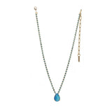 Electric Blue TOVA Milli Necklace, Swarovski crystal jewelry, gold plated teardrop necklace, electric blue pendant, pink crystal necklace, luxury statement jewelry, designer brass necklace, vibrant crystal pendant. at ooh la la! in Grapevine TX 76051