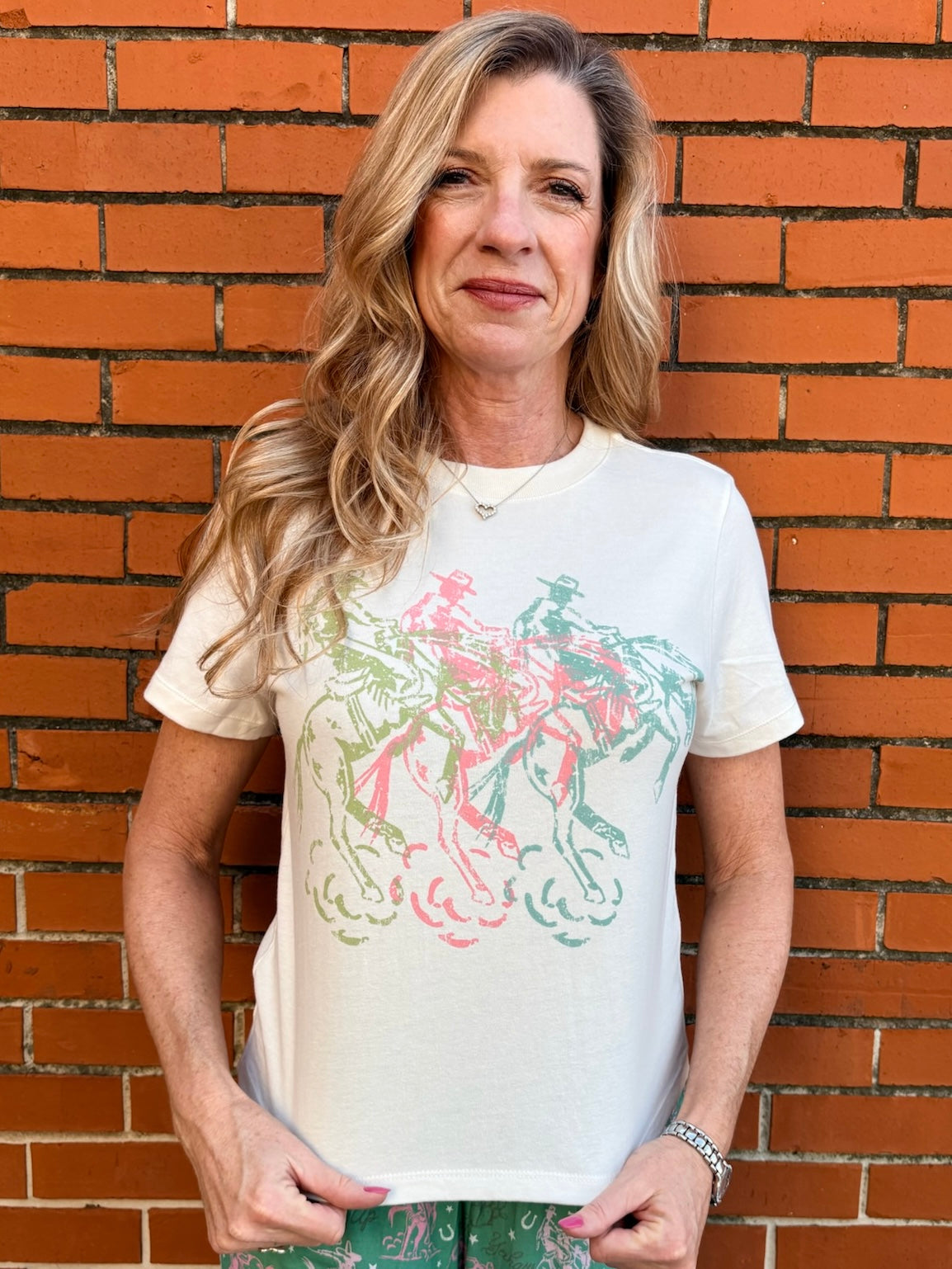 Western crop top, cowboy graphic tee, pastel western shirt, mid-length crop tee, southern fashion, rodeo outfit, vintage cowboy shirt, coastal cowgirl aesthetic. at ooh la la! in Grapevine TX 76051