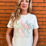 Western crop top, cowboy graphic tee, pastel western shirt, mid-length crop tee, southern fashion, rodeo outfit, vintage cowboy shirt, coastal cowgirl aesthetic. at ooh la la! in Grapevine TX 76051