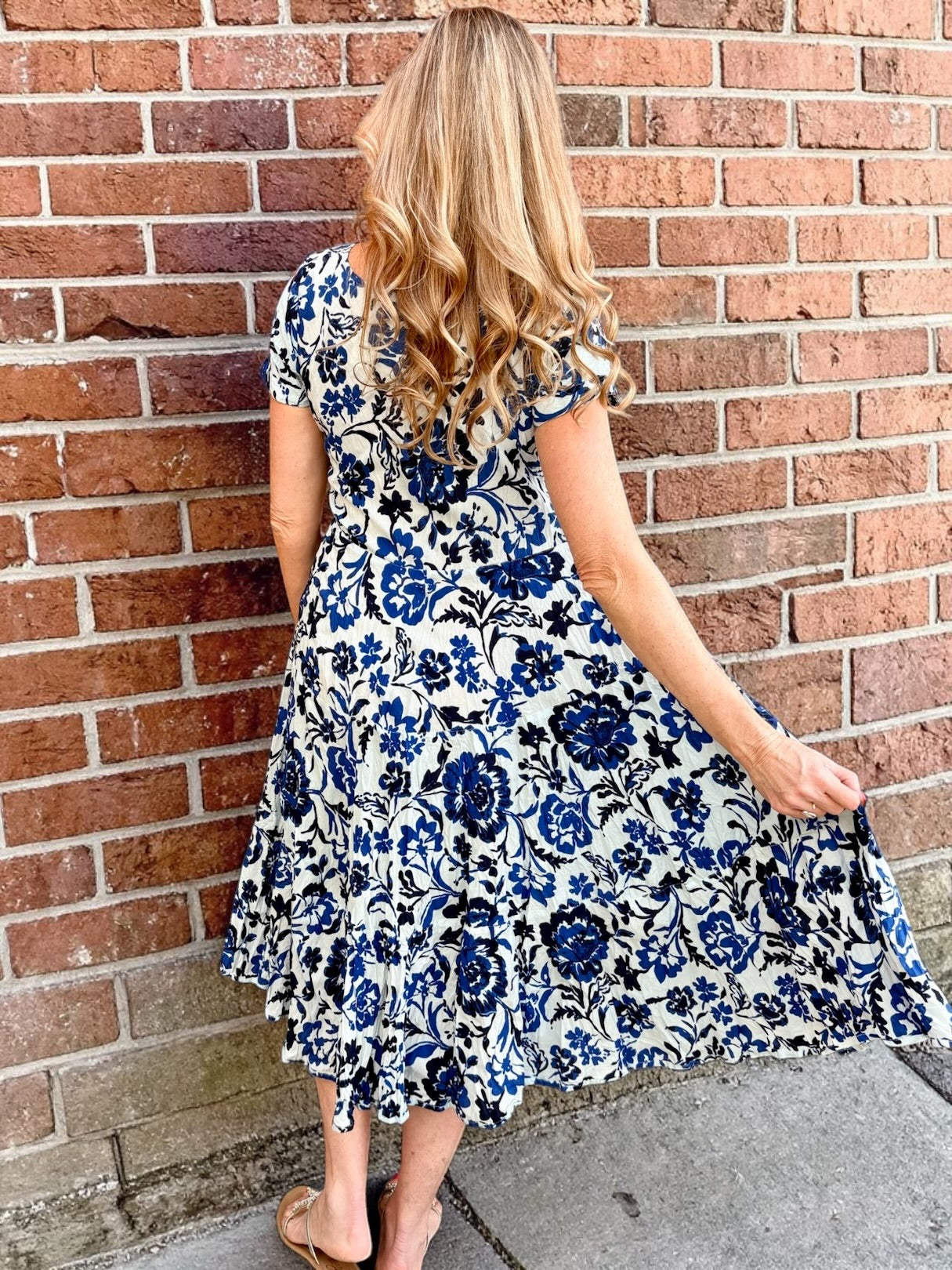 Dress Addict Jazy, organic cotton midi dress, blue floral dress with pockets, sustainable summer dress, bias cut v-neck dress, women's tiered floral midi, travel-friendly crinkle dress. at ooh la la! in Grapevine TX 76051