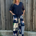Made in Italy Satin Horse Print Pants in navy at ooh la la! in Grapevine TX 76051
