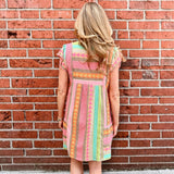Boho beach dress, neon summer dress, flutter sleeve mini, geometric print dress, tassel trim dress, resort wear for women, cotton v-neck dress, vacation outfits, colorful sun dress. at ooh la la! in Grapevine TX 76051