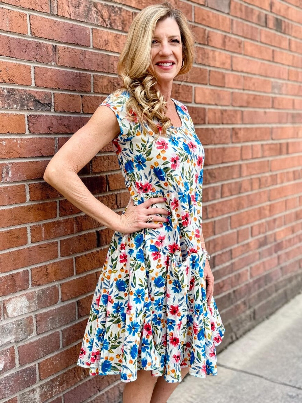 Dress Addict Jade dress, organic cotton floral dress, daisy print scoop neck, bias cut cotton dress, crinkle cotton summer dress, sustainable floral fashion, tiered skirt knee length dress at ooh la la! in Grapevine TX 76051