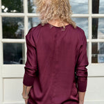 Satin Long Sleeve V-Neck Blouse In wine at ooh la la! In Grapevine TX 76051