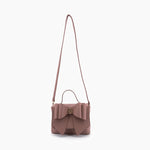 Vegan leather crossbody in blush, bow satchel bag, designer vegan handbags, women's spring purses, bow front handbag, gold hardware crossbody, eco-friendly satchel, Zoey bag.
ooh la la! in Grapevine TX 76051
