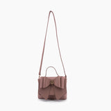 Vegan leather crossbody in blush, bow satchel bag, designer vegan handbags, women's spring purses, bow front handbag, gold hardware crossbody, eco-friendly satchel, Zoey bag.
ooh la la! in Grapevine TX 76051