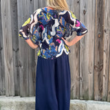 Made in Italy Satin Wide Leg Pants in navy at ooh la la! in Grapevine TX 76051