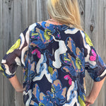 Abstract Flower Print Silk Raw Edge Blouse in navy at ooh la la! in Grapevine TX 76051