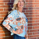 Abstract Pink & Blue Batwing Sweater at ooh la la! in Grapevine TX 76051