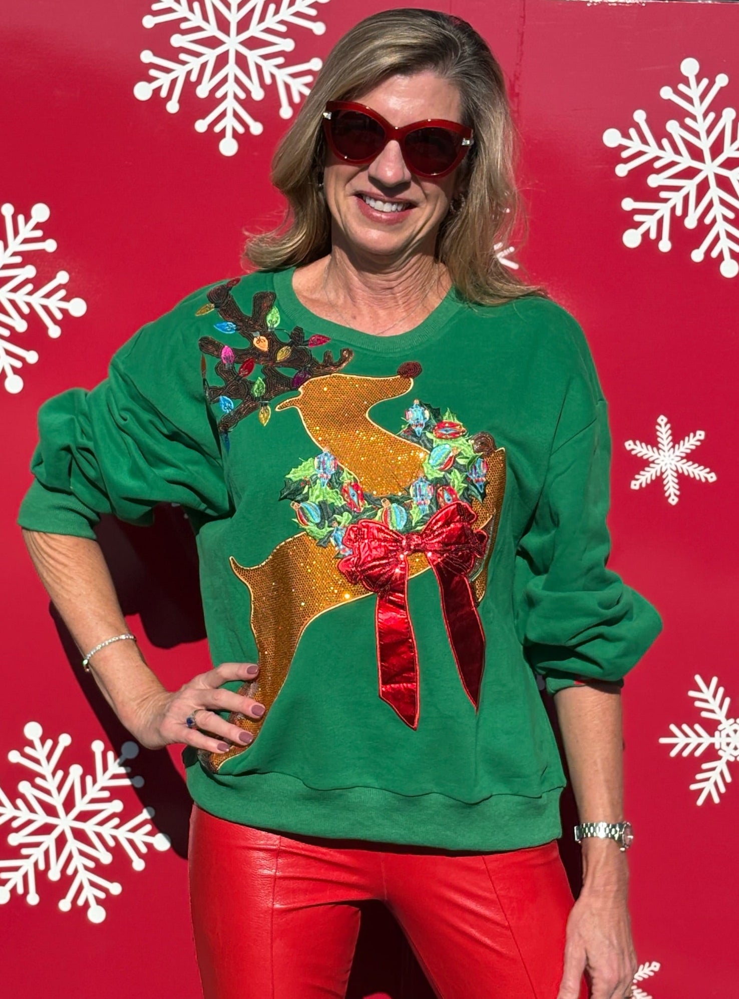 Queen of Sparkles Rhinestone Rudolph Wearing A Wreath Sweatshirt at ooh la la! in Grapevine TX 76051