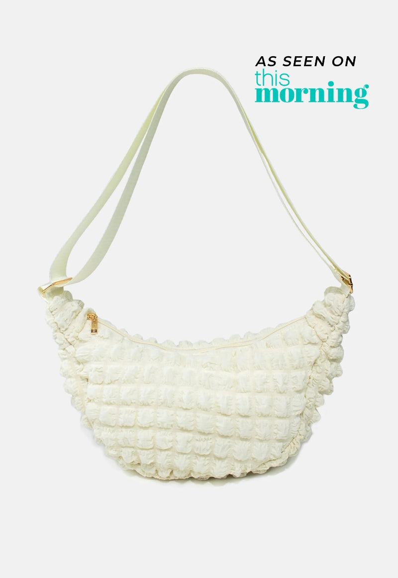 Kind Bag London - Puff Crescent Crossbody Bag in cream at ooh la la! in Grapevine TX 76051