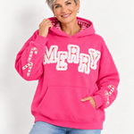 Woman wearing hot pink Simply Southern Merry appliqué hoodie with candy cane details at ooh la la! in Grapevine TX 76051