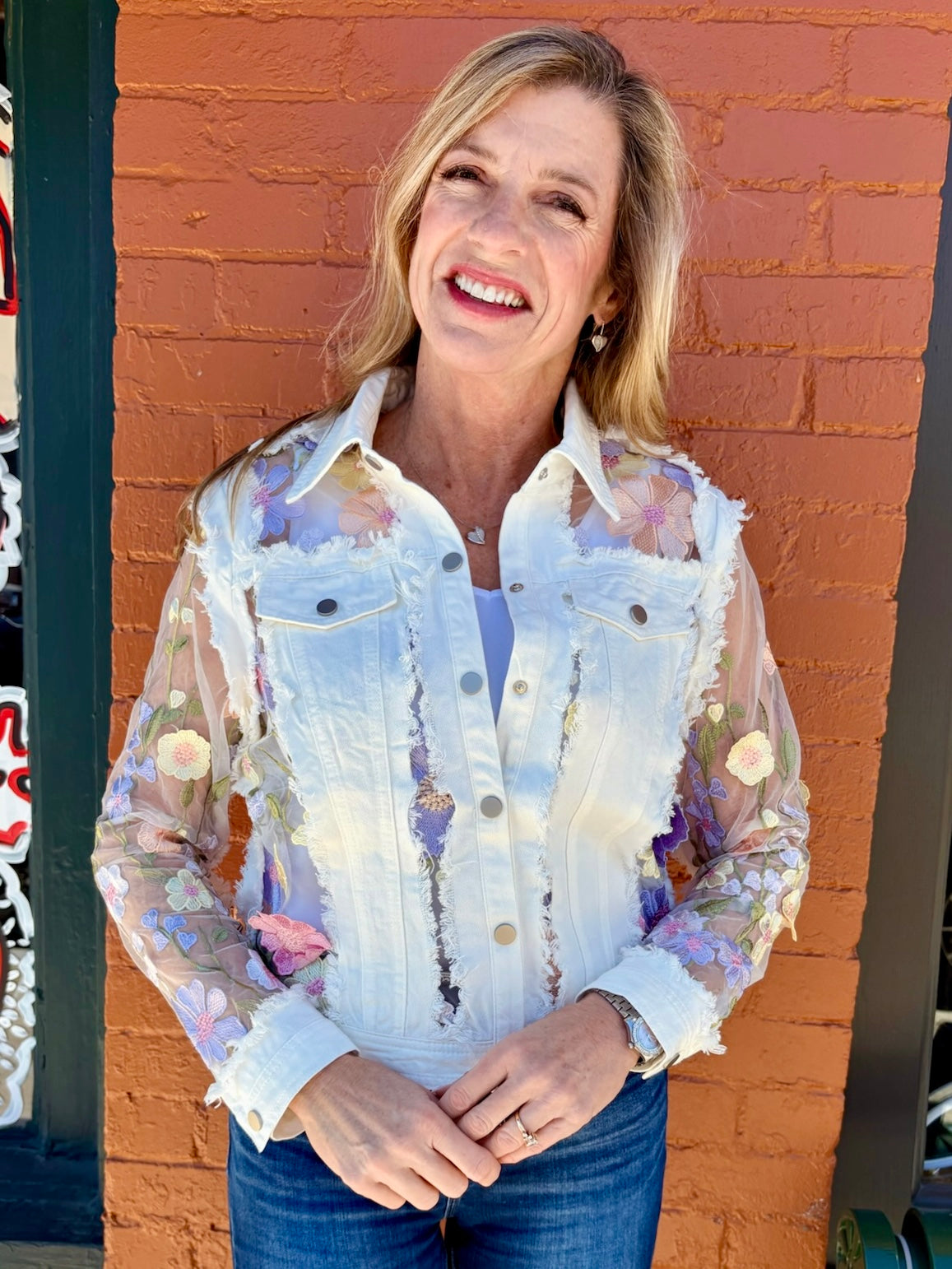 Denim Jacket with Floral Appliqué on Mesh in white at ooh la la! in Grapevine TX 76051
