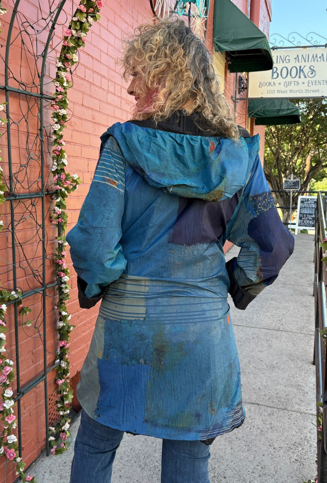 Reversible Hooded Rain Coat In blue blocks/black at ooh la la! in Grapevine TX 76051