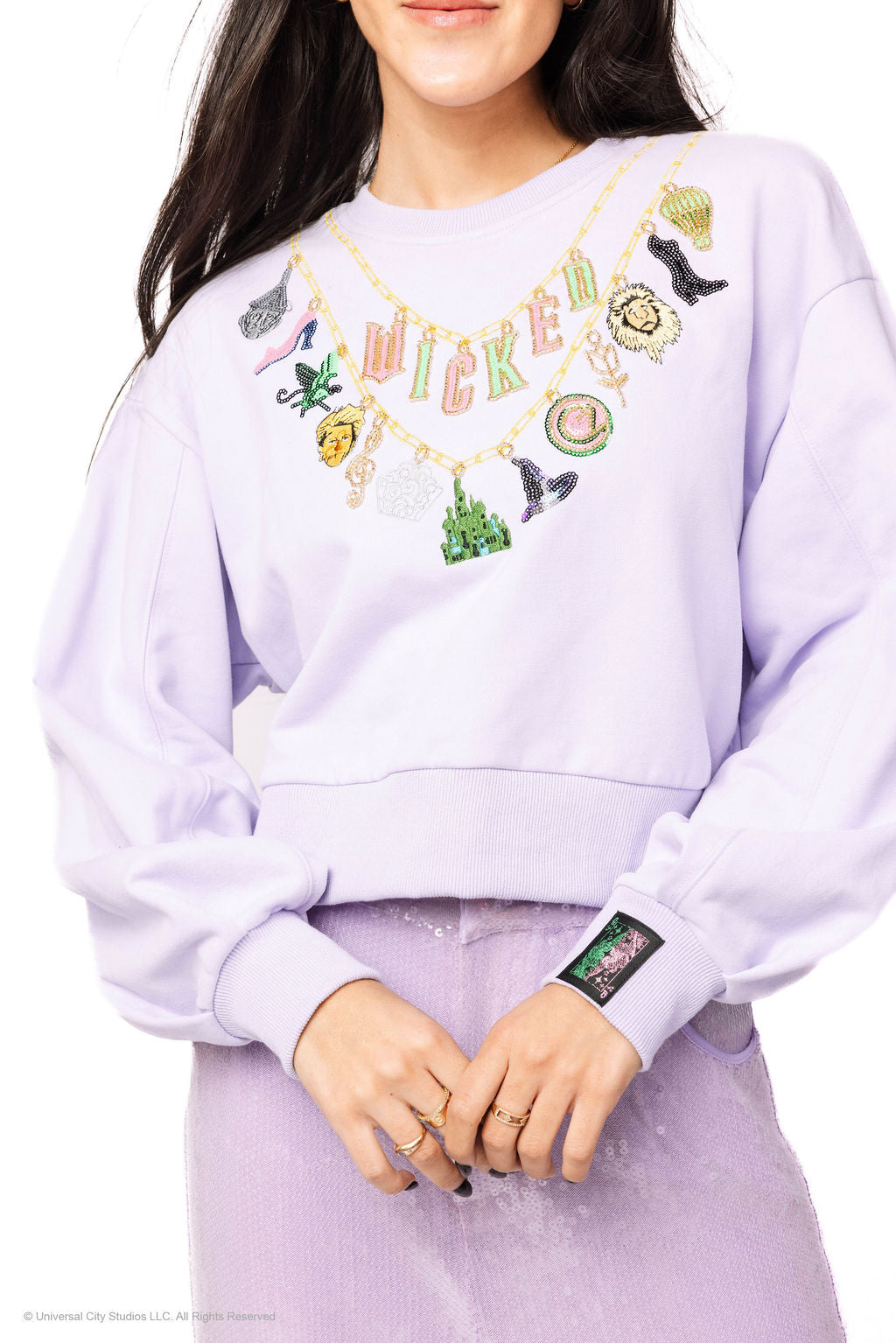 Wicked X Queen of Sparkles Lavender Wicked Charm Necklace Sweatshirt at ooh la la! in Grapevine TX 76051