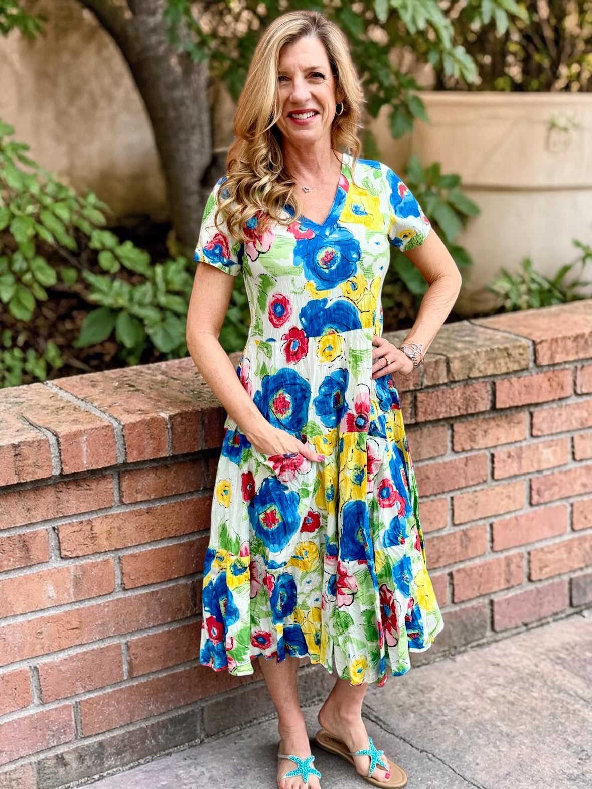 Dress Addict Jazy, organic cotton midi dress, multi color floral dress with pockets, sustainable summer dress, bias cut v-neck dress, women's tiered floral midi, travel-friendly crinkle dress. at ooh la la! in Grapevine TX 76051