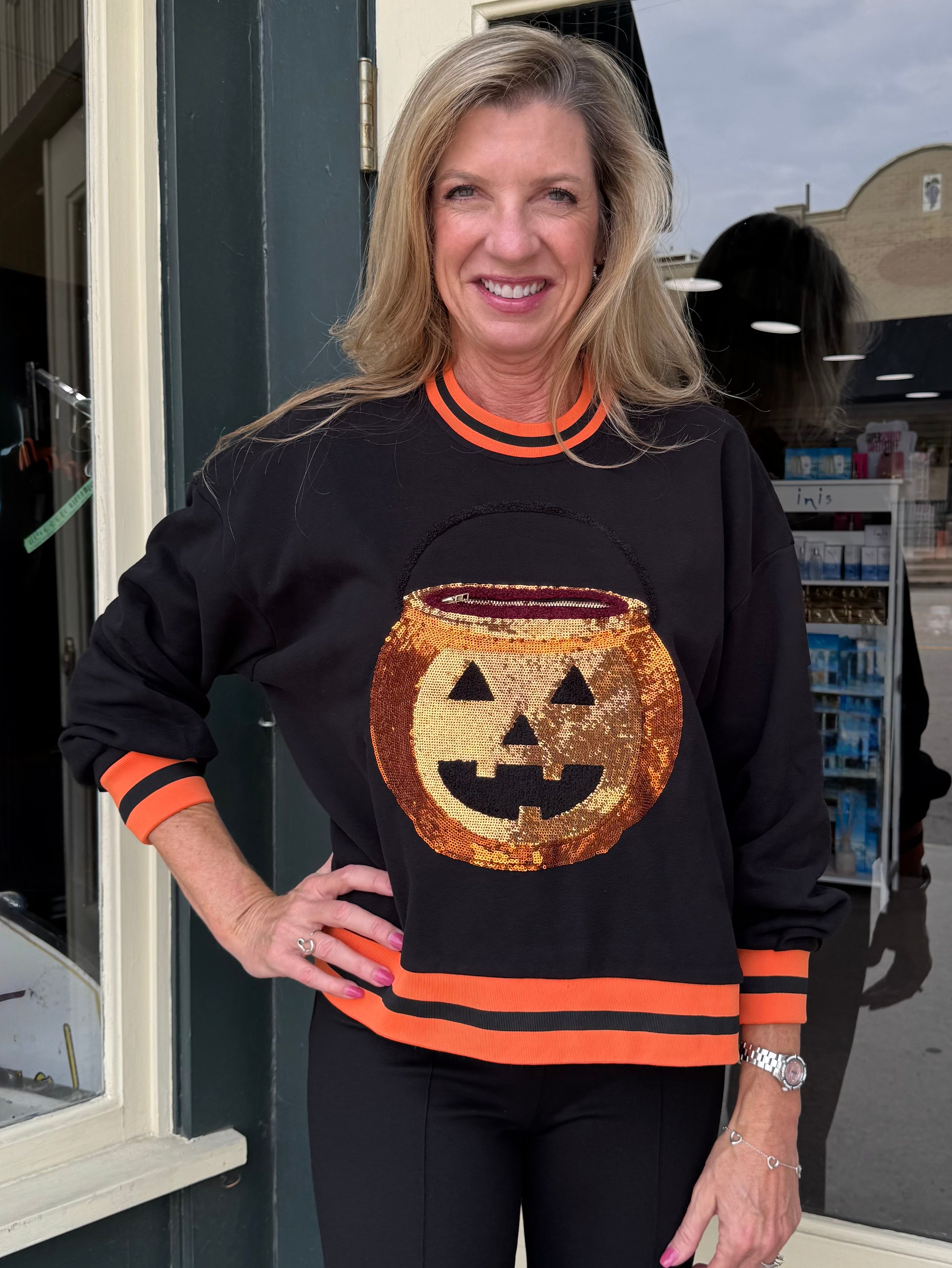 Queen of Sparkles Black Halloween Pumpkin Candy Bucket Sweatshirt at ooh la la! in Grapevine TX 76051