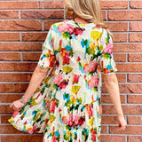 Organic cotton dress, floral shirt dress, tiered summer dress, Dress Addict, crinkle cotton dress, sustainable fashion, abstract floral print, summer dresses with pockets. at ooh la la! in Grapevine TX 76051