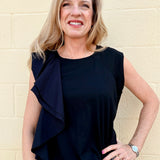 Black Asymmetrical top, ruffle crop top, sporty chic shirt, women's statement top, oversized cropped tee, streetwear fashion, architectural ruffle blouse.
at ooh la la! in Grapevine TX 76051