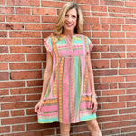 Boho beach dress, neon summer dress, flutter sleeve mini, geometric print dress, tassel trim dress, resort wear for women, cotton v-neck dress, vacation outfits, colorful sun dress. at ooh la la! in Grapevine TX 76051