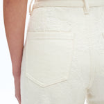 off white floral cutout jeans, embroidered straight leg pants, women's cream denim, high rise relaxed jeans, boho lace pants, luxury embroidered denim, off white floral trousers at ooh la la in Grapevine TX 76051