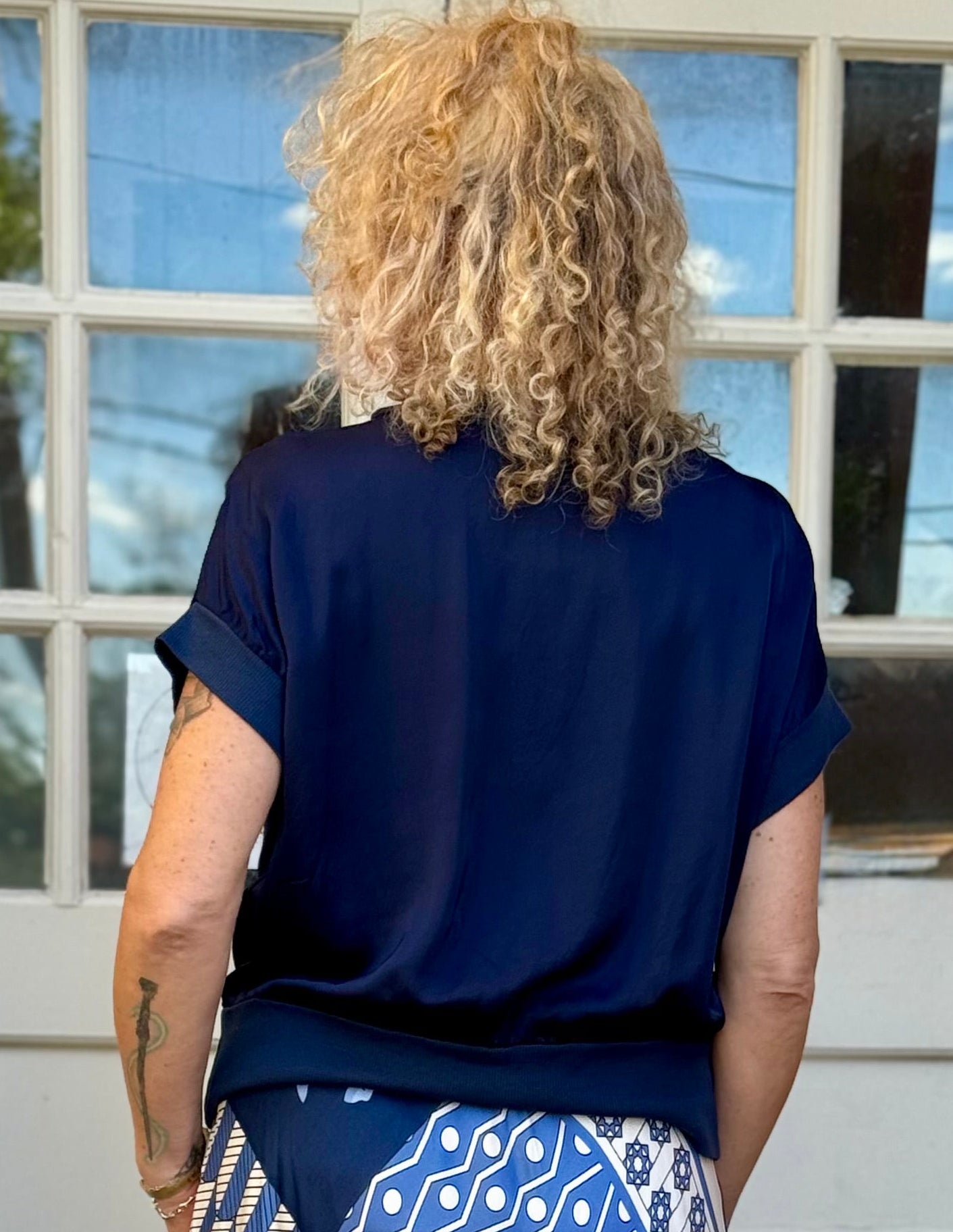 Satin Short Sleeve Top with Rib Knit Trim in navy at ooh la la! in Grapevine TX 76051