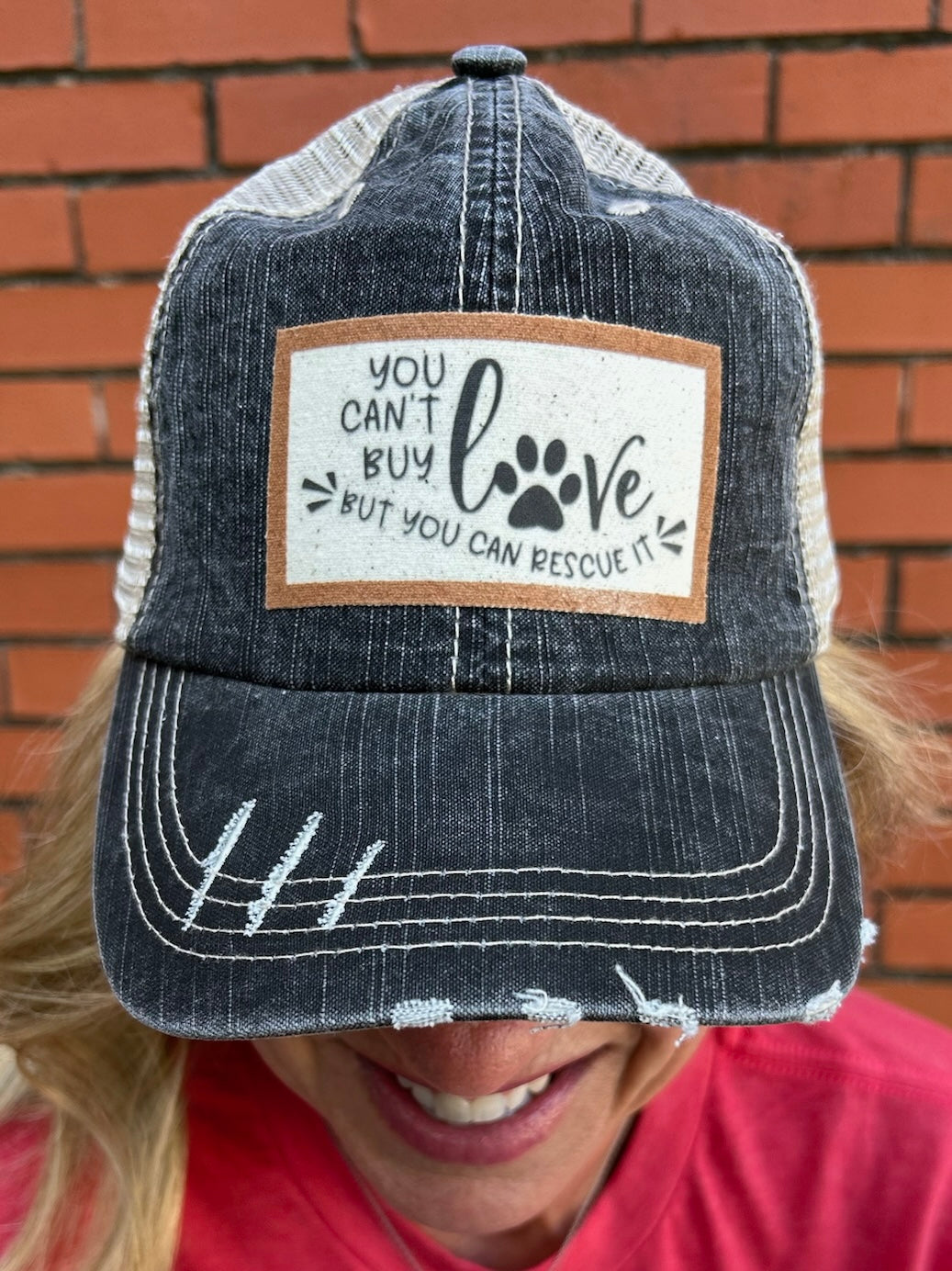 “You Can’t Buy Love But You Can Rescue It” ball cap at ooh la la! in Grapevine TX 76051