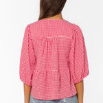 red gingham top, tiered cotton blouse, puff sleeve shirt, cherry red top, v-neck tie blouse, women's summer cotton tops, textured cotton blouse at ooh la la! in Grapevine TX 76051