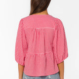 red gingham top, tiered cotton blouse, puff sleeve shirt, cherry red top, v-neck tie blouse, women's summer cotton tops, textured cotton blouse at ooh la la! in Grapevine TX 76051