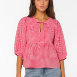 red gingham top, tiered cotton blouse, puff sleeve shirt, cherry red top, v-neck tie blouse, women's summer cotton tops, textured cotton blouse at ooh la la! in Grapevine TX 76051