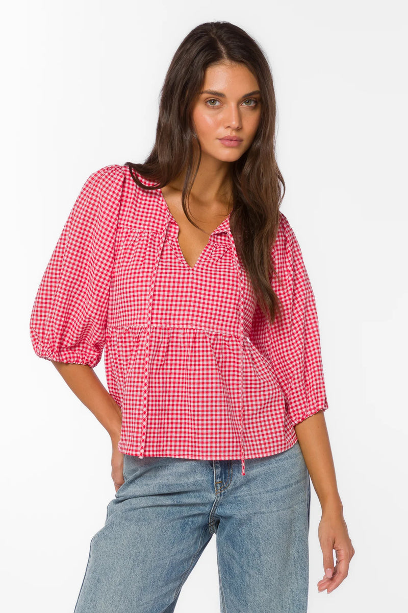 red gingham top, tiered cotton blouse, puff sleeve shirt, cherry red top, v-neck tie blouse, women's summer cotton tops, textured cotton blouse at ooh la la! in Grapevine TX 76051