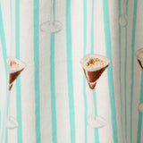 Close-up of flannel fabric with espresso martini print on aqua striped pool blue background